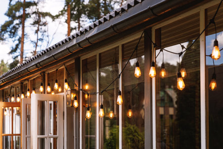 String Lights Hanging on Terrace Roof During Golden Hour