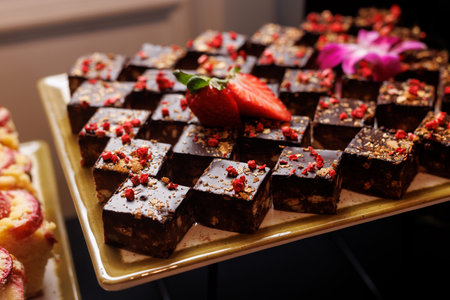 Chocolate squares with strawberry and edible decorations