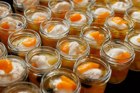 Mandarin dessert cups with whipped cream toppingの写真素材