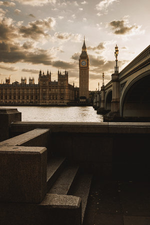 Evening view of Big Ben and the Houses of Parliament with Westminster Bridge over the River Thames...