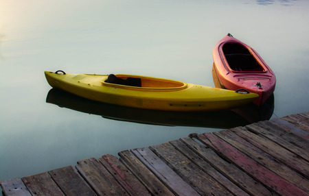 Yellow and Red Kayak on the lakeの写真素材