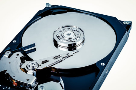 Close up inside of Hard disk drive on white background.