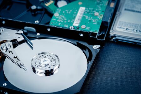 Close up inside of hard disk drive. Blue tone image.の写真素材