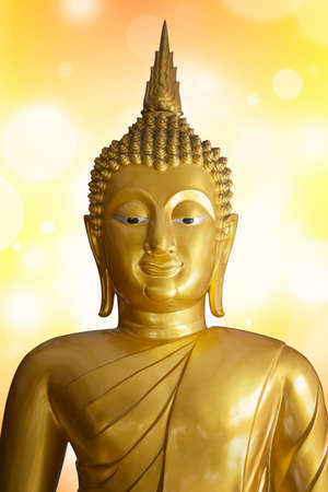 Buddha statue on bokeh backgroundの写真素材