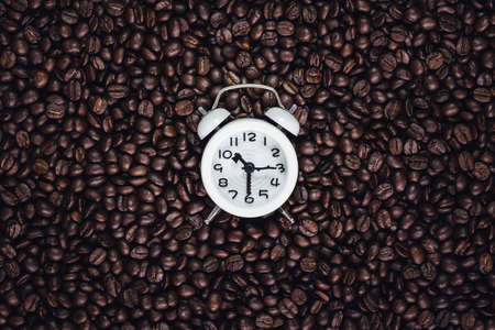 Roasted coffee and clockの写真素材
