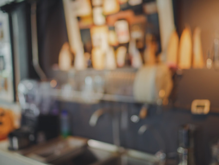 blurred background coffee drink behind counter.の写真素材