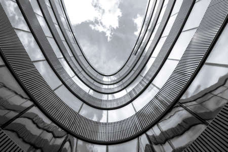 Low angle view of modern office building. Black and white picture Low angle view of modern office building. Black and white picture