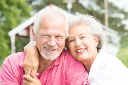 Happy and smiling senior couple at the beach Happy and smiling senior couple at the beach