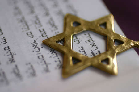 A Golden Star of David, a Jewish symbol, over the first word of the book of Genesis. A Golden Star of David, a Jewish symbol, over the first word of the book of Genesis.