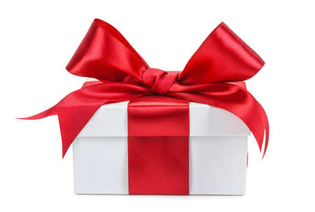 White gift box with red ribbon and bow isolated. White gift box with red ribbon and bow isolated.