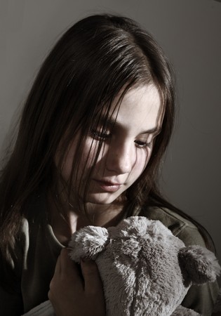 Lonely child with toyの写真素材