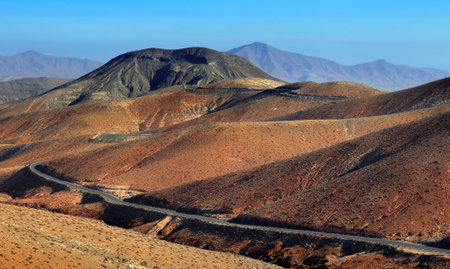 Winding road across the dunes, in the Canary Islands, Spain の写真素材