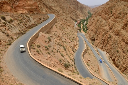 DADES GORGES, MOROCCO - JULY 11  Cars on a winding road, July 11, 2013 in Dades Gorges, Morocco  Road in Dades Gorges very popular tourist route in east Morocco のeditorial素材