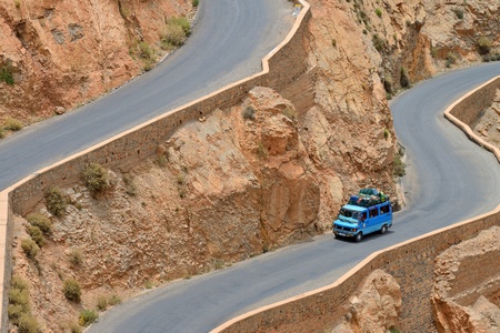 DADES GORGES, MOROCCO - JULY 11  Overloaded car on a winding road, July 11, 2013 in Dades Gorges, Morocco  Road in Dades Gorges very popular tourist route in east Morocco のeditorial素材