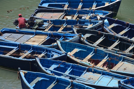 ESSAOUIRA - JULY 15  Unknown man work in harbor of Essaouira, Morocco, July 15, 2013  Essaouira is one of the most popular tourist place on Atlantic coast in Morocco のeditorial素材