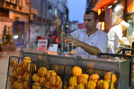 ISTANBUL - AUGUST 7  Unknown man trades fresh orange juice in a street, August 7, 2013 in Istanbul, Turkey  Istanbul is the world s fifth-most-popular tourist destination のeditorial素材