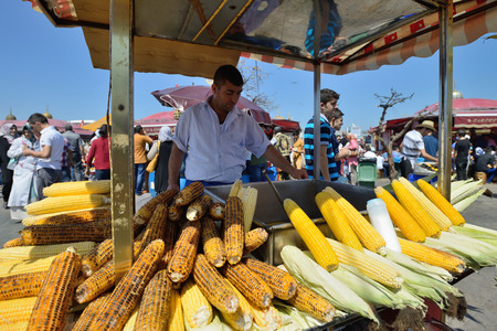 ISTANBUL - AUGUST 8  Unknown man trades traditional turkish food in a street near harbor, August 8, 2013 in Istanbul, Turkey  Istanbul is the world s fifth-most-popular tourist destinationのeditorial素材