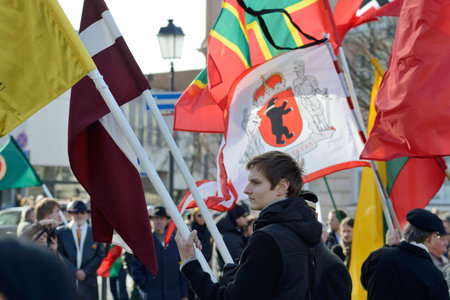 VILNIUS, LITHUANIA - MAR 11  Around one thousand people gathered with flags in a nationalist rally at Rotuses Square on Re-Establishment of Independence Day on March 11, 2014 in Vilnius, Lithuaniaのeditorial素材