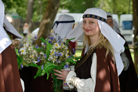VILNIUS, LITHUANIA - JULY 6  Unidentified peoples in traditional Lithuanian Song Celebration on July 6, 2014 in Vilnius, Lithuania  Song Festival is Lithuania s main cultural event for 2014 のeditorial素材