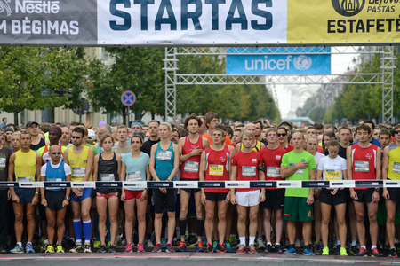 VILNIUS, LITHUANIA - SEPTEMBER 14: Runners on start of the 10 km and 5 km tracks of 11th Danske Bank Vilnius Marathon on 14 September, 2014 in Vilnius, Lithuaniaのeditorial素材