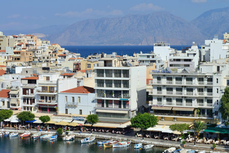 CRETE, AGIOS NIKOLAOS - AUGUST 09: town of Agios Nikolaos, Crete, Greece on 09 August 2014. Agios Nikolaos is one of the most popular tourism destinations in East Region of Crete island.のeditorial素材