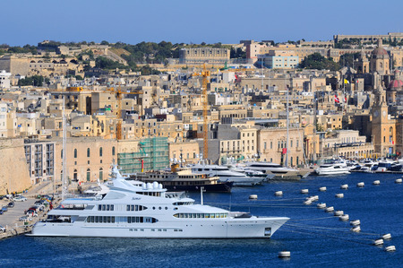 VALLETTA, MALTA - APR 17 :Valletta Port in Malta April 17, 2011. The Valletta port is a popular tourist attraction full of cafes and restaurants.のeditorial素材