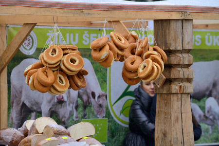 VILNIUS, LITHUANIA - MARCH 7: Unidentified people trade home made bread in annual traditional crafts fair - Kaziuko fair on Mar 7, 2015 in Vilnius, Lithuaniaのeditorial素材