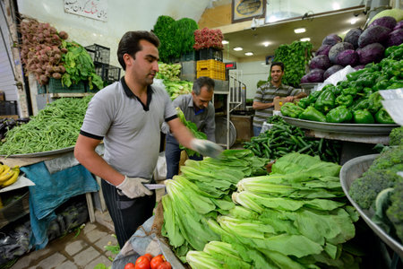YAZD  APRIL 16: Unknown people trades fresh vegetables and fruits in street market in Yazd Iran on April 16 2015. Yazd  is the capital of Yazd Province Iran and a centre of Zoroastrian culture.のeditorial素材