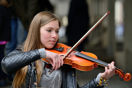 VILNIUS LITHUANIA  MAY 16: Unidentified musician play violin in Street music day on May 16 2015 in Vilnius. Its a most popular event on May in Vilnius Lithuaniaのeditorial素材