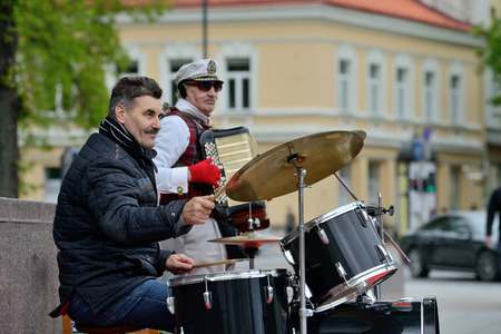 VILNIUS LITHUANIA  MAY 16: Unidentified musician plays drums and other instruments in Street music day on May 16 2015 in Vilnius. Its a most popular event on May in Vilnius Lithuaniaのeditorial素材