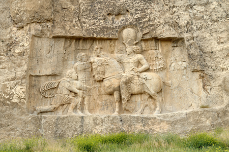 Rock relief cuted into the cliff. Naqsh-e Rustam, an ancient necropolis in Pars Province, Iranのeditorial素材