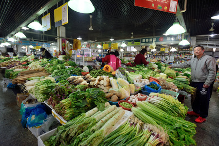 SHANGHAI, CHINA - MARCH 19: Unidentified Chinese people trades traditional food in local market on March 19, 2016 in Shanghai, China. Shanghai is the largest Chinese city by population.のeditorial素材