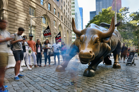 NEW YORK CITY, USA - AUG. 23 : Charging Bull in Lower Manhattan on August 23, 2017 in New York City, NY. Charging Bull is symbol of "aggressive financial optimism and prosperity"のeditorial素材
