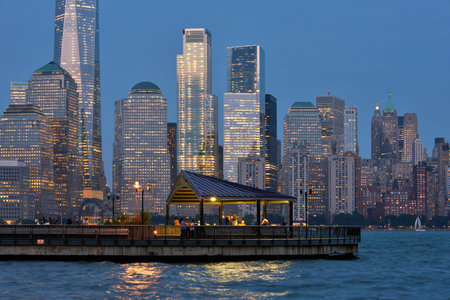 JERSEY CITY, USA - AUG. 23 : Hudson River pier and Manhattan on August 23, 2017 in New York City, NY. Manhattan is the most densely populated borough of New York City.のeditorial素材