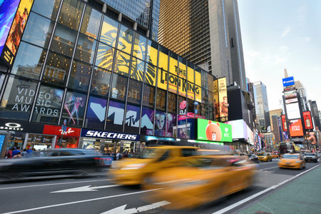 NEW YORK CITY - AUG. 26 : Yellow Taxi on Times Square in Manhattan on August 26, 2017 in New York City, NY. Times Square is a major tourist destination and entertainment center.のeditorial素材