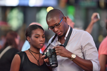 NEW YORK CITY, USA - AUG. 26 : Unidentified people on the Times Square in Manhattan on August 26, 2017 in New York City, NY. Times Square is a major commercial intersection, tourist destination and entertainment center in NYC.のeditorial素材