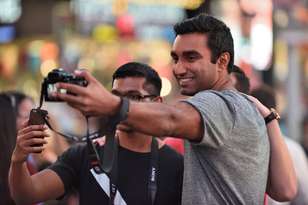 NEW YORK CITY, USA - AUG. 26 : Unidentified people on the Times Square in Manhattan on August 26, 2017 in New York City, NY. Times Square is a major commercial intersection, tourist destination and entertainment center in NYC.のeditorial素材