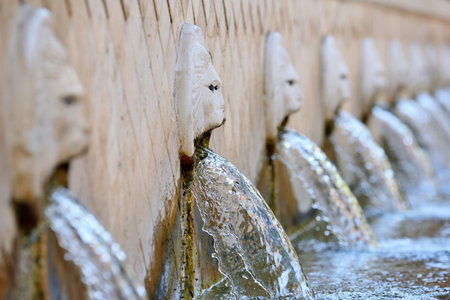 Old venetian fountain with lion heads springs pure drinking water in Spili, Crete island, Greeceの写真素材