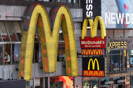 NEW YORK CITY - AUG. 24 : MacDonalds signs on the Times Square in Manhattan on August 24, 2017 in New York City, NY. Times Square is a major tourist destination and entertainment center.のeditorial素材