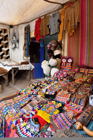 PISAC, PERU - September 04, 2016: Colourful goods for sale in marketplace in Pisac, Peru on September 04, 2016. Pisac is a town and an Inca archaeological site in Peru.のeditorial素材