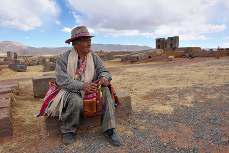 TIWANAKU, BOLIVIA - August 26, 2016: Unknown man with traditional costume on August 26, 2016. Tiwanaku is a Pre-Columbian archaeological site in western Boliviaのeditorial素材
