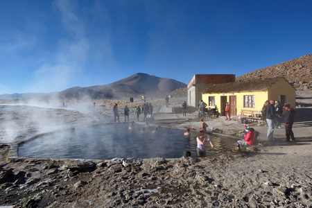 BOLIVIA - August 30, 2016: People enjoying a Termas de Polques hot springs on August 30, 2016. Pools of geothermal spring water located in the Atacama Desert, Bolivia.のeditorial素材