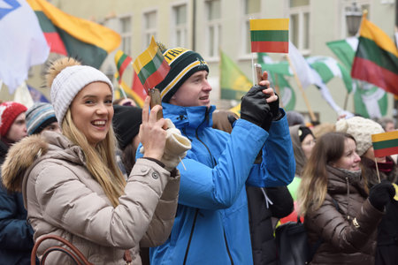 Vilnius, Lithuania - February 16: unidentified people gathered with flags in a natonal celebration for the Day of Independence of Lithuania on February 16th, 2018 in Vilnius, Lithuania.のeditorial素材