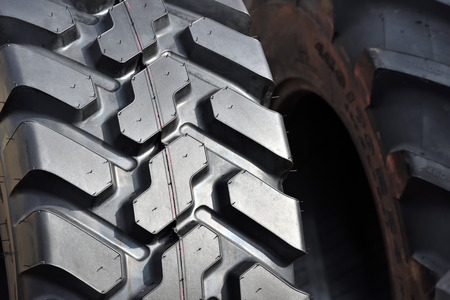 Big truck or tractor wheel a black tires closeupの写真素材