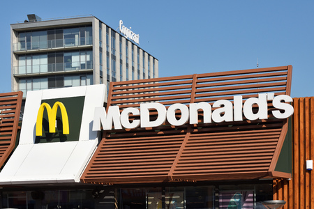 Vilnius, Lithuania - May 16: McDonalds logo on a building on May 16, 2018 in Vilnius Lithuania. McDonalds is the largest chain of hamburger fast food restaurants in the worldのeditorial素材