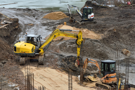 Vilnius, Lithuania - February 16: Excavators on construction site on February 16, 2019. Vilnius is the capital of Lithuania and its largest city.のeditorial素材