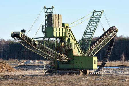 Stone crusher in the quarry. Working mining machine - stone crusher. Quarrying of stones for...