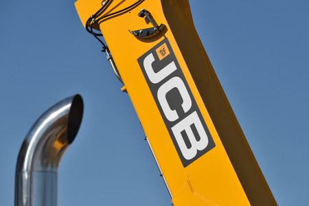 Kaunas, Lithuania - April 04: JCB heavy duty equipment vehicle and logo in Kaunas on April 04, 2019.  JCB corporation is manufacturing equipment for construction and agricultureのeditorial素材