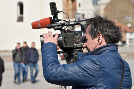 Vilnius, Lithuania - April 06: TV camera man in Vilnius Old Town on April 06, 2019 in Vilnius...