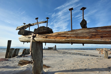 Old wood pier on the Baltic Sea at sunsetの写真素材